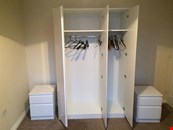 Hygena Harpur high gloss white 3 door wardrobe and 2 bedside cabinets