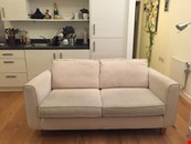 Cream 3 seater DFS sofa and matching footstool with storage for sale. Excellent condition.